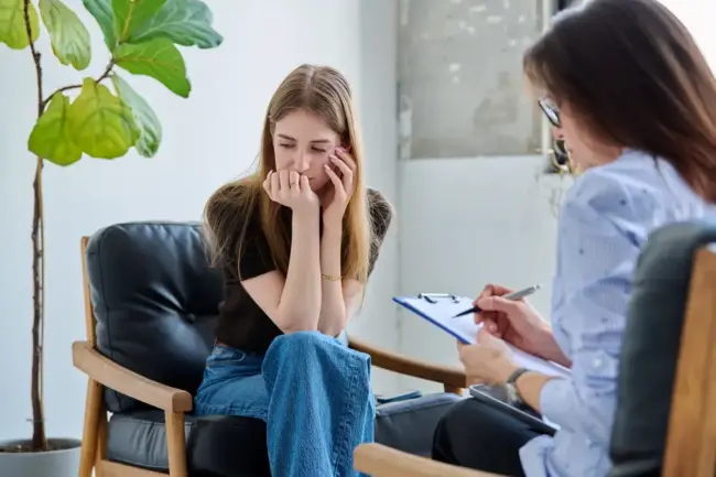 Patient receiving guidance about EXOMIND Therapy for cognitive wellness